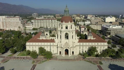Aerial view of Pasadena City Hall, with its domed tower centered against the city and San Gabriel Mountains