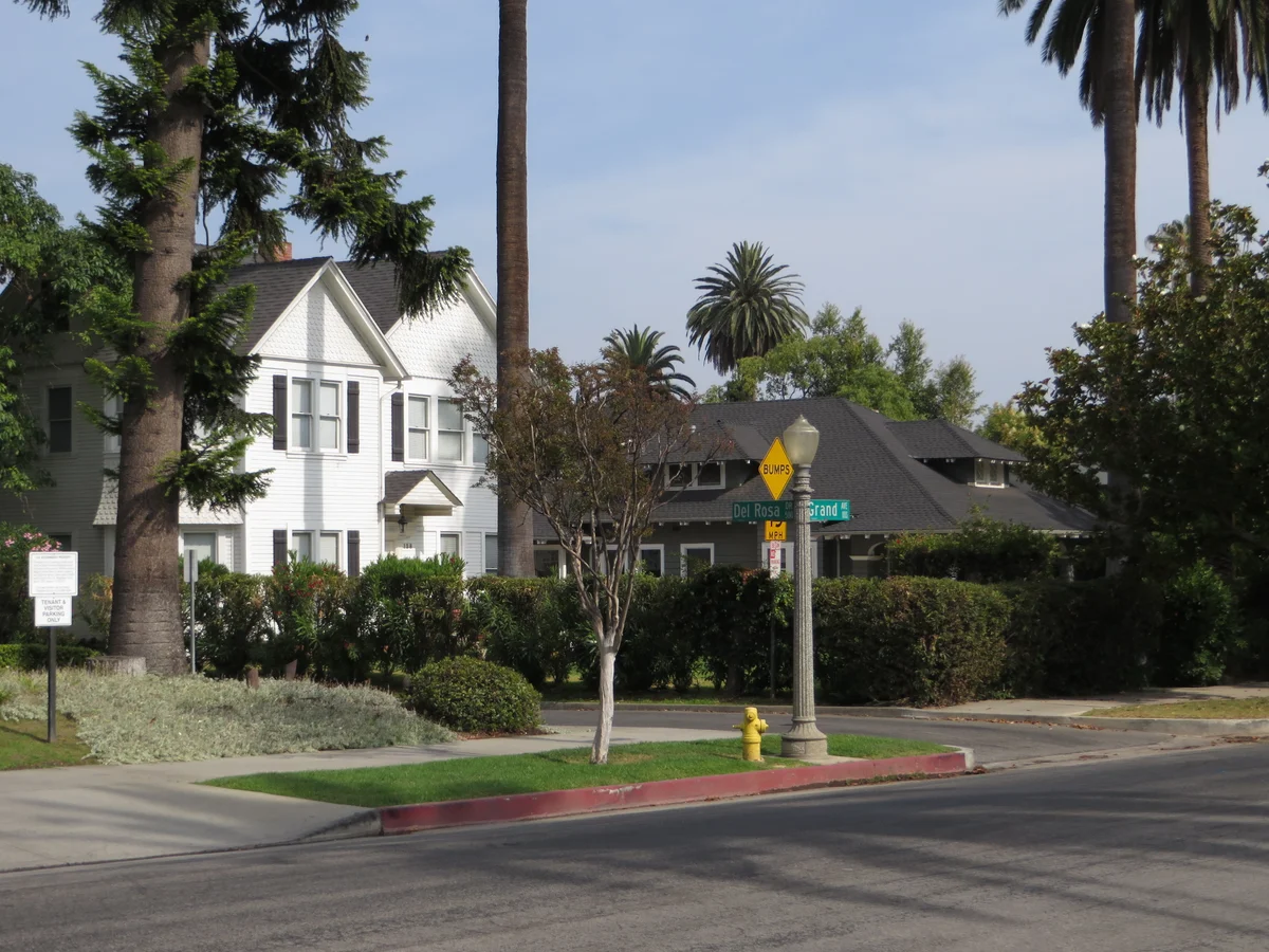 Pasadena homes at Del Rosa Road and Grand Avenue, framed by palm trees